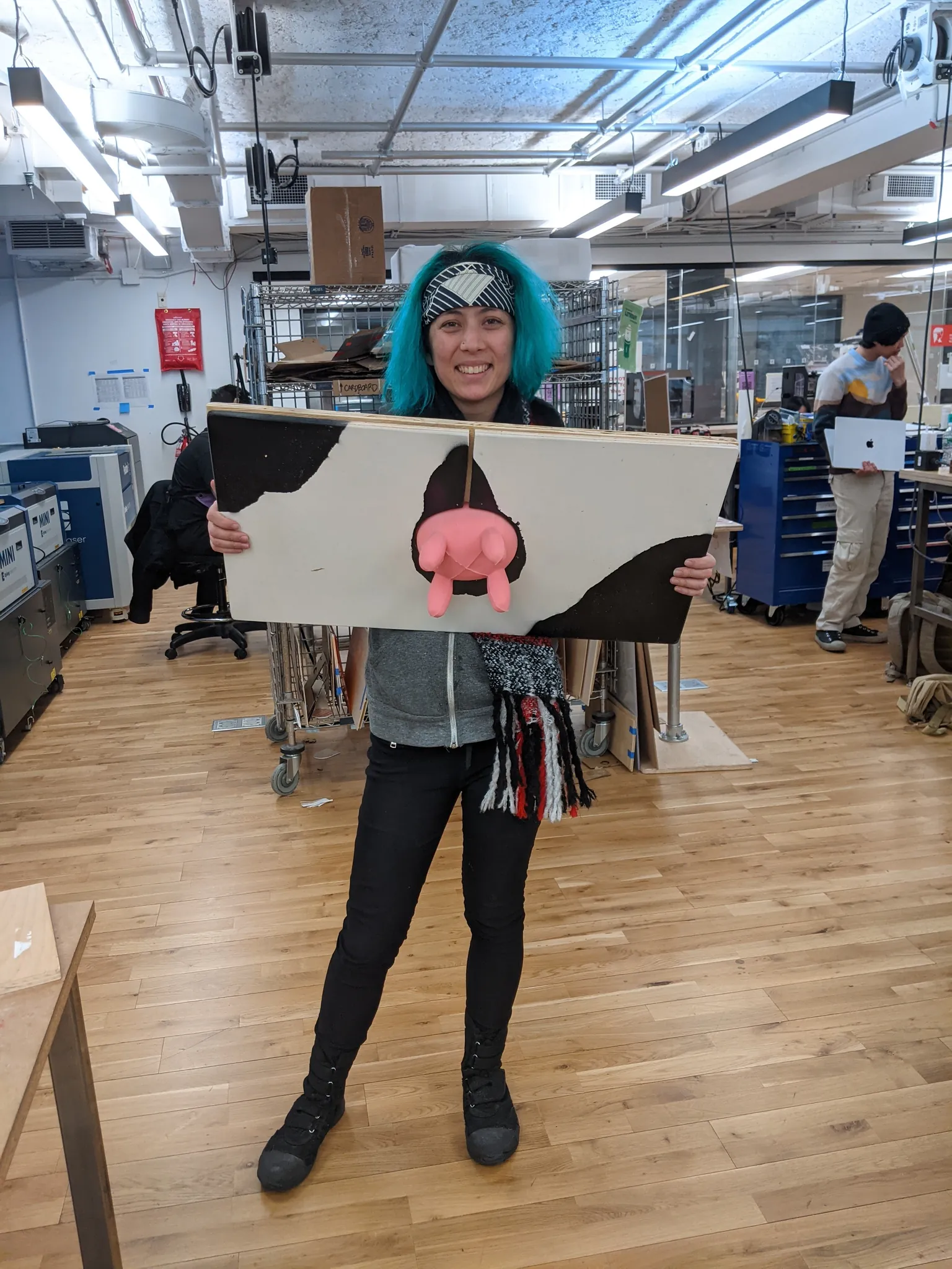Photo of green haired girl holding up