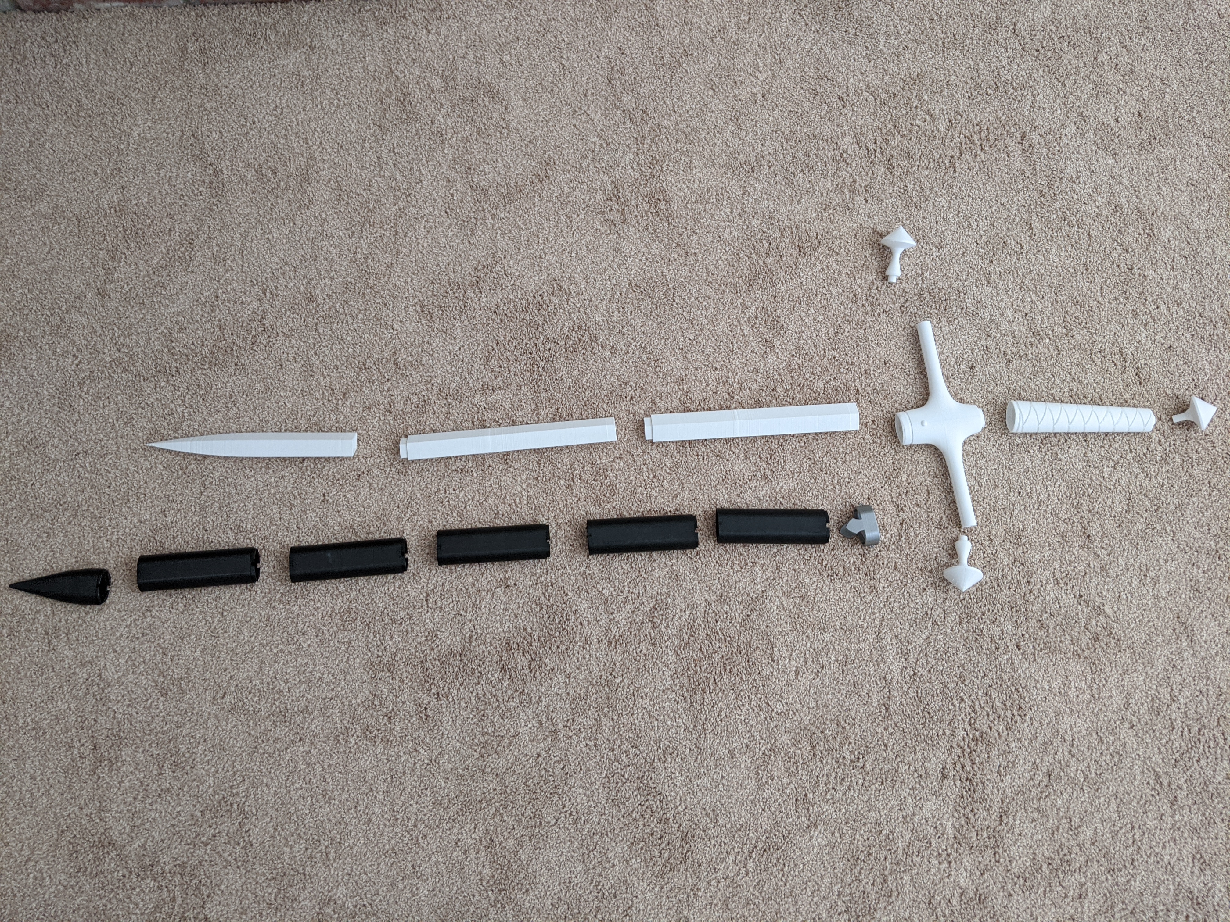 Photograph of a finished 3D printed sword with all pieces disassembled