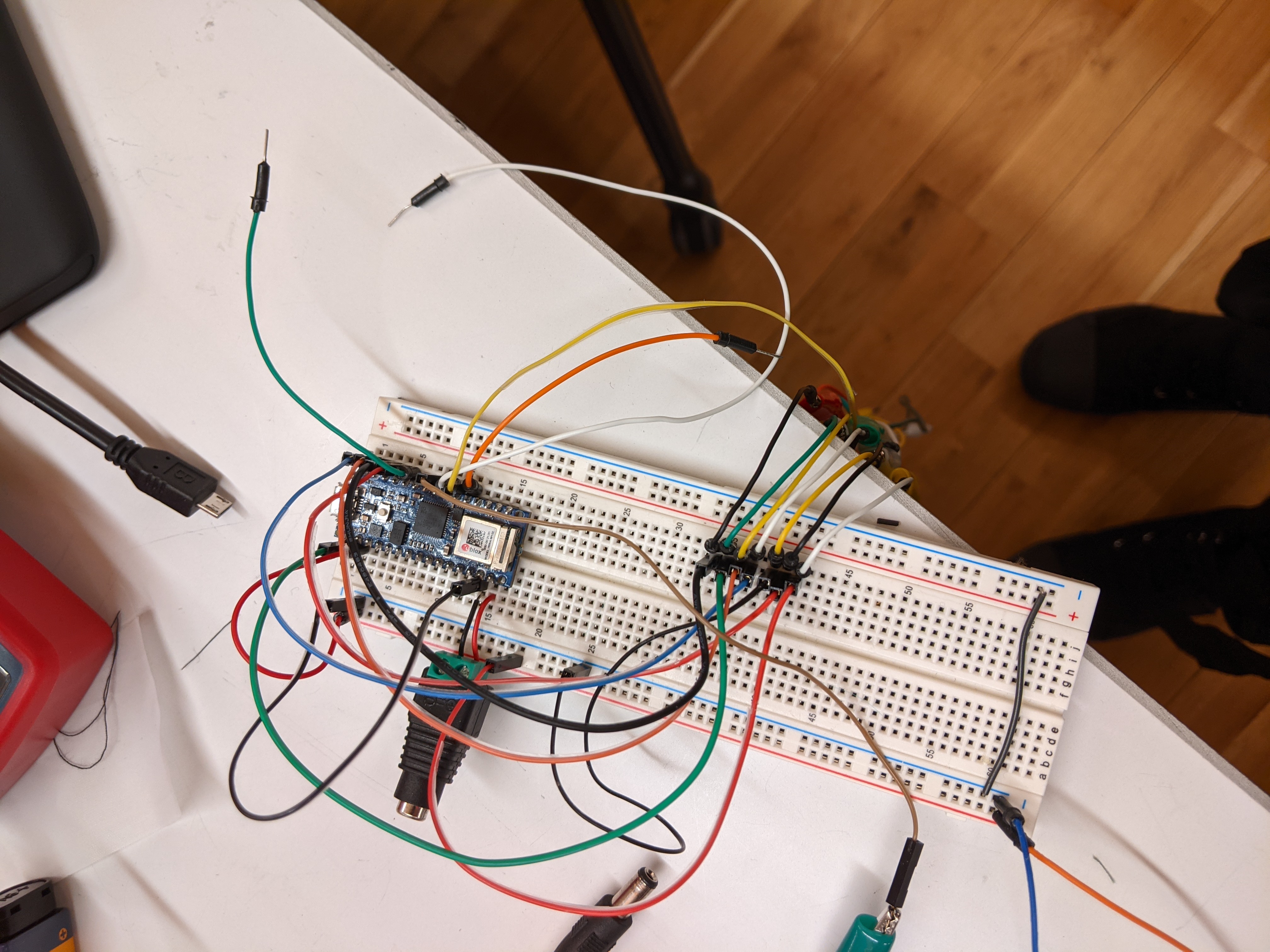 Photograph of jumper wires sticking out of a breadboard