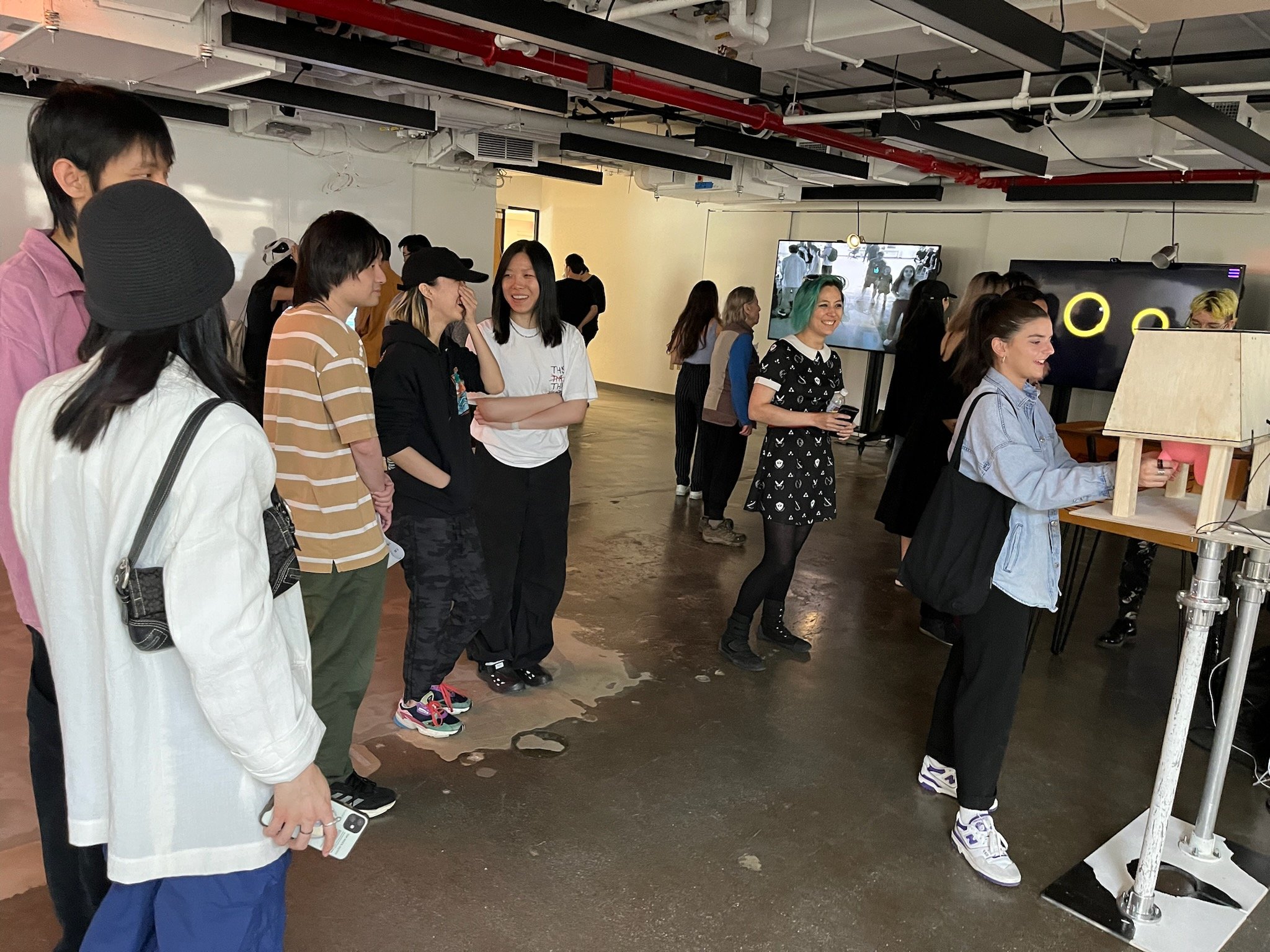 Photograph of a line of people waiting to play the game